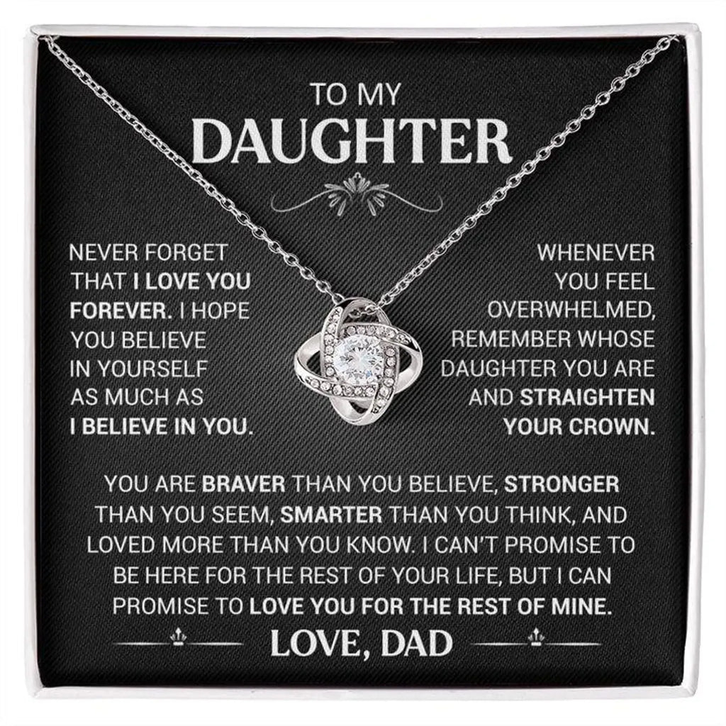 Silver-tone love-knot necklace on its To My Daughter message card, signed Love, Dad